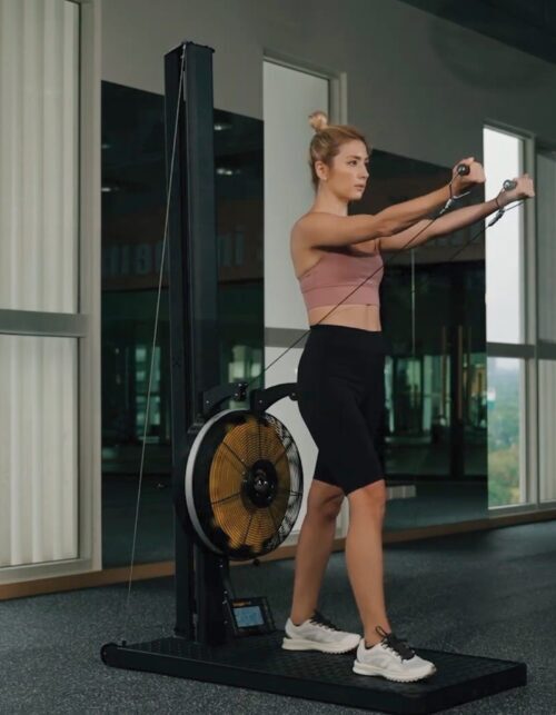 Person exercising on ski machine heavy duty, commercial grade like Hyrox Training down position 3 position adjustable