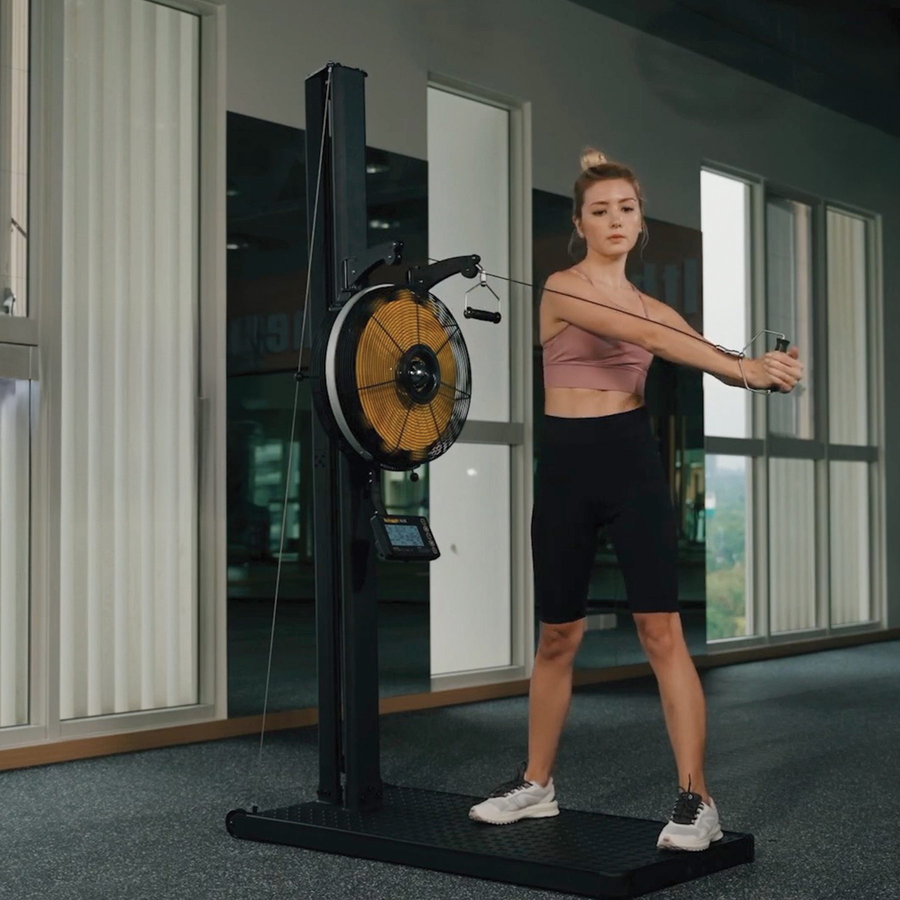 Person exercising on ski machine heavy duty, commercial grade like Hyrox Training middle position 3 position adjustable